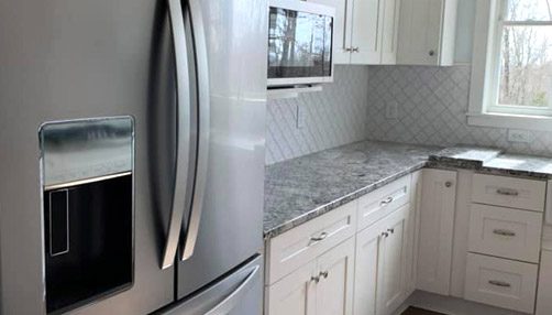 Siding by the Best - newly renovated kitchen with stainless steel appliances